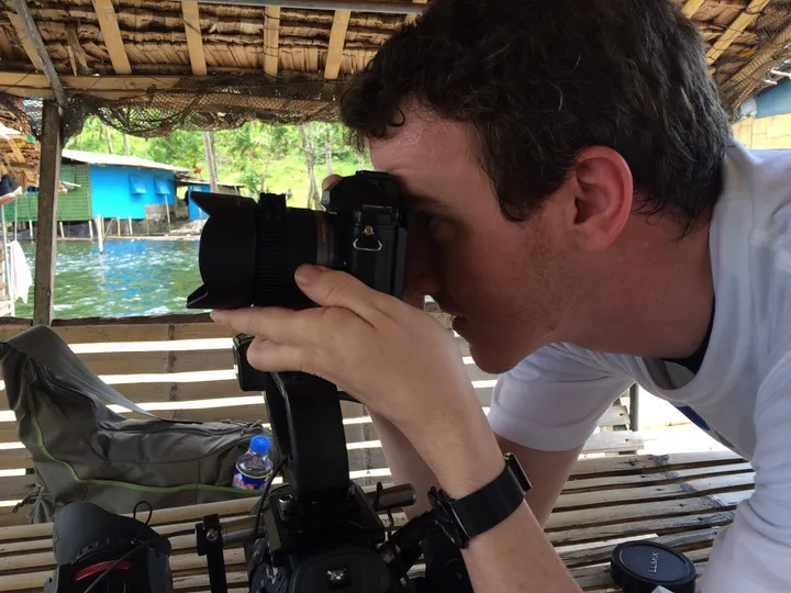 Filming with a Canon C100 on a bamboo raft at Pandin Lake