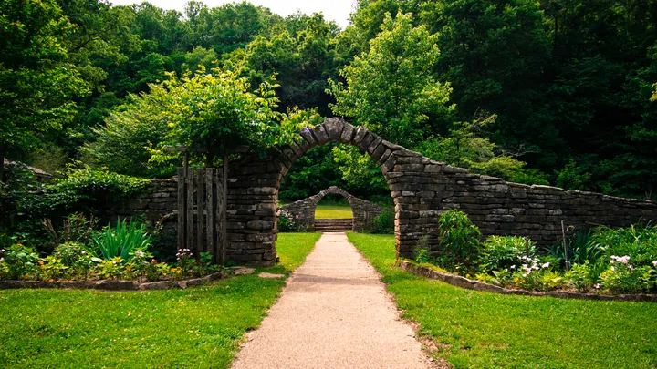 Stone archway and garden path at Spring Mill State Park
