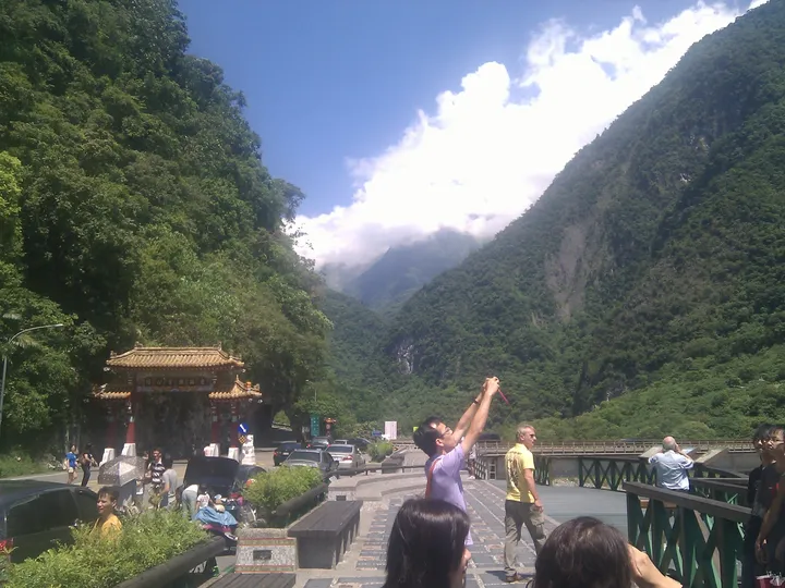 Taroko Gorge entrance with towering green mountains and clouds